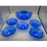 Blue glass serving bowl with 5 smaller bowls