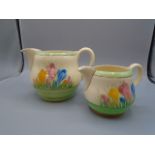 Clarice Cliff 'crocus' jugs x 2 large jug is cracked at handle on the inside