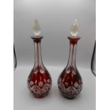 pair of cranberry decanters