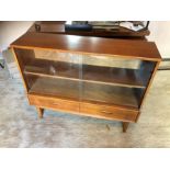 Retro bookcase with glass sliding doors and drawers at bottom