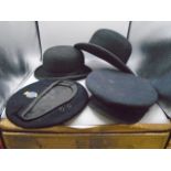 2 bowler hats and 2 wartime naval hats