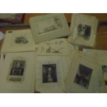A red folder with about 80-100 various prints