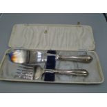 Silver handled fish knife and fork plus 3 silver tea spoons, all hallmarked