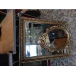 A gilt framed mirror 56x71cm and a decorative gold coloured mirror 51cm long