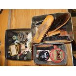 a collection of boot brushes, polishes and a box of sewing accessories such as threads, pins etc