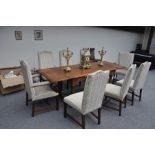 A REPRODUCTION OAK PLANK TOP DRAW LEAF REFECTORY TABLE, in the 18th century style, on turned legs