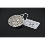 Scottish discoidal sterling silver brooch in the form of a shield with raised decoration of Celtic