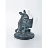 green patinated cold cast sculpture, of a mouse reading a book
