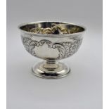 Victorian silver rose bowl of conventional form with embossed floral, foliate and scroll decoration,