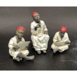 Group of Bergman Austrian cold-painted bronze figures of seated teacher and 2 students wearing robes