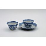 Two blue and white Chinese cups with saucer