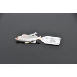 English sterling silver brooch in the form of a fish, pin mounted to rear, gilt head and fins, the