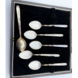 set of six silver and enamelled coffee spoons in original case