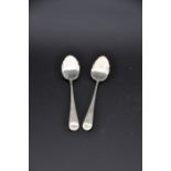 Pair of English sterling silver teaspoons with scallop shell bowls and bright-cut decoration, London