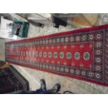 Bamboo ladder and red patterned runner 12ft long worn in places