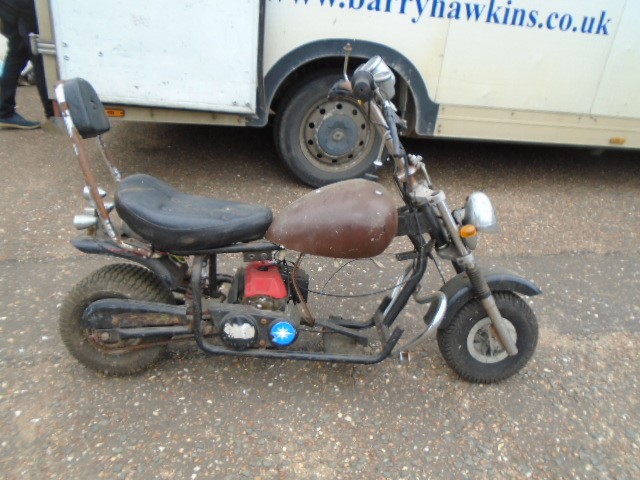 Childs chopper style bike with little engine, haven't had it running, body needs attention