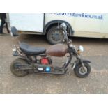 Childs chopper style bike with little engine, haven't had it running, body needs attention