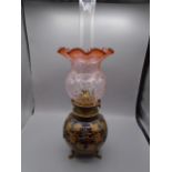 Cranberry glass oil lamp, crack in the shade