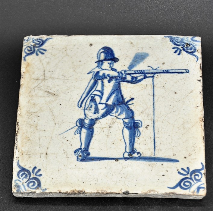 Dutch Delftware blue on white tin glazed tile c. 1690, depicts a musketeer discharging his weapon - Image 2 of 3