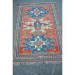 A Caucasian Eagle Kazak rug from the Karabagh region. Early-mid 20th century. the red fields with