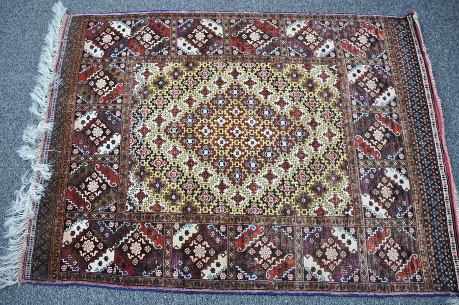 A Persian hand knotted silk pile rug 192cm x 126.