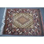 A Persian hand knotted silk pile rug 192cm x 126.