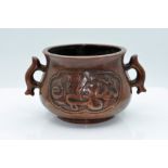 Chinese Patinated Bronze two-handled Sensor, 11.5cm diameter excluding handles, 9cm high, seal