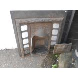 cast iron fireplace with grate etc, spaces for tiles either side