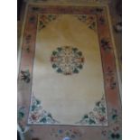 Cream and pink patterned rug 1.83 x 1.88m