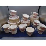Colclough part tea set, white with honeysuckle design, comprising of 11 cups, 12 saucers, 12 cake