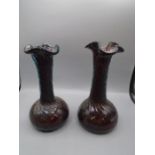 pair of handblown twisted vases, claret but have a blue hue when held to the light 26cm tall