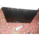 Wall mounted with bracket Hitachi 21 inch TV with remote ( house clearance )