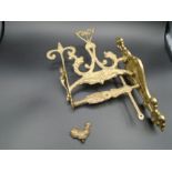 A decorative brass Fixing plate for bell pull, bell part missing