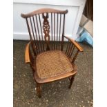 Edwardian mahogany cane seat wheel back armchair