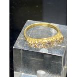 An 18ct gold five stone diamond ring set with line of brilliant cut diamonds, gross weight 3.4g,