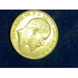 Great Britain, 1909 gold full sovereign, Edward VII, rev; St George and Dragon above date. 7.9g