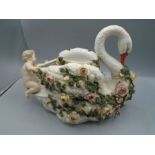 Antique china swan with Cherub, covered in flowers, as found