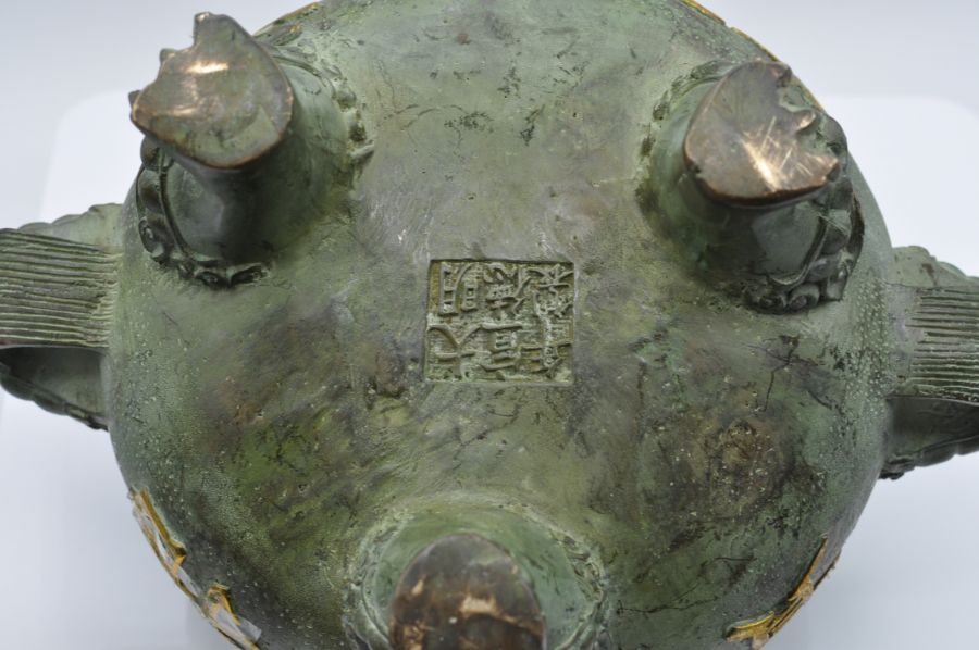 A Chinese Verdigris Patinated Bronze two-handled Sensor with dragon heads on tri-form feet, 19cm - Image 3 of 3