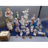 collection of figurines some in capodimonte style