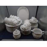 West German part dinner service, white with blue flower garlands, comprising 12 dinner plates, 6