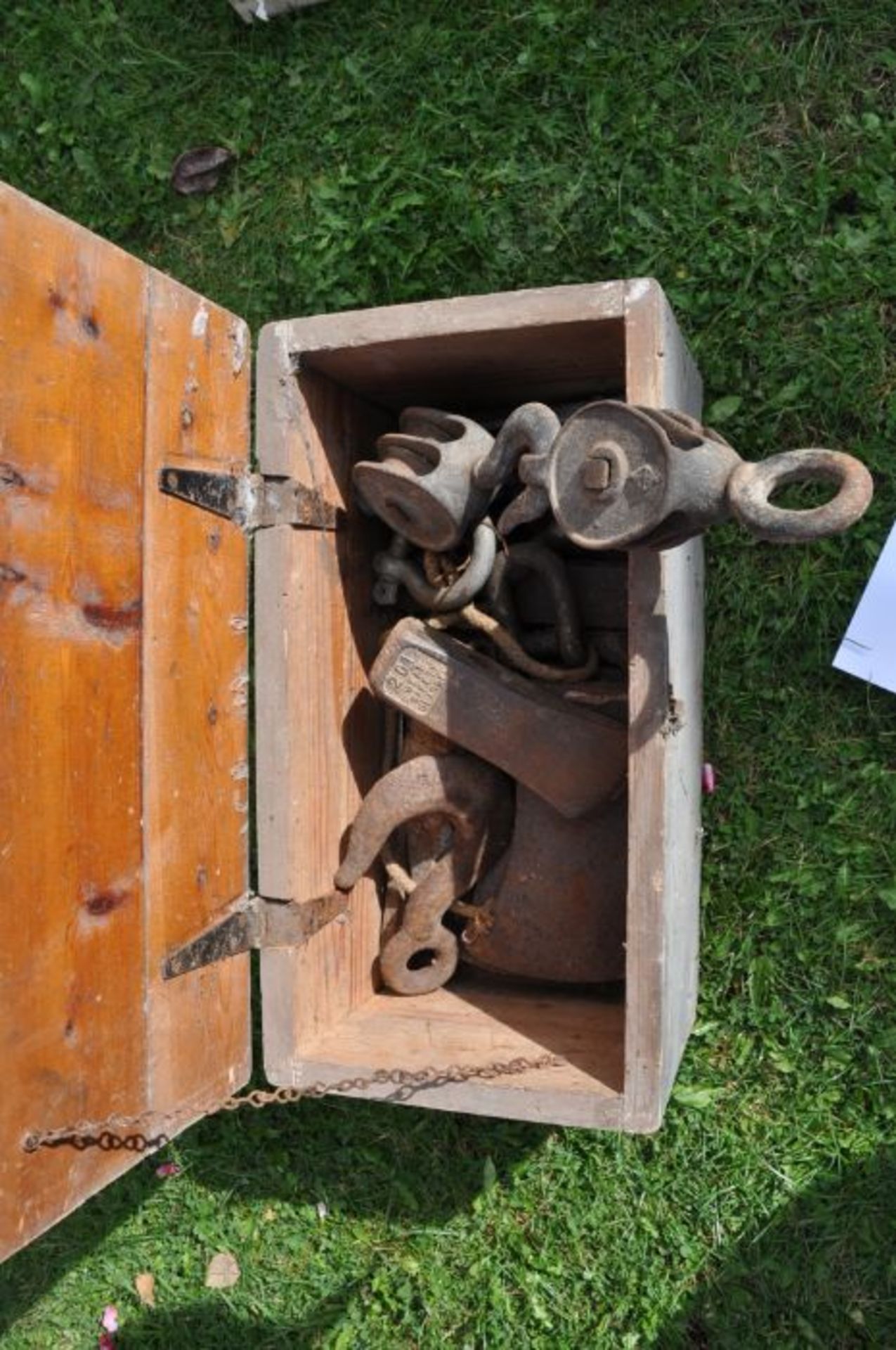 Wooden box includes pully blocks and axe heads