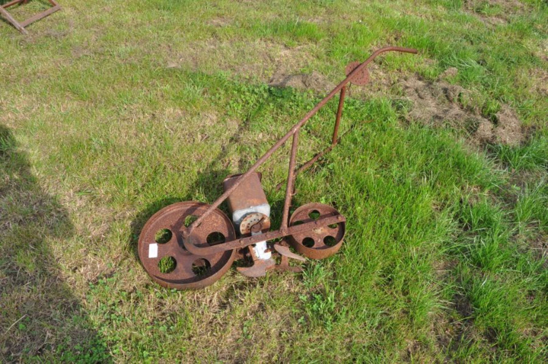 Vintage hand push seed drill with spare components