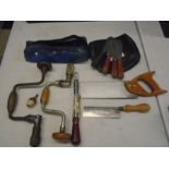 various tools to include saws, brass plumbline, drill braces and bits, paint scrapers etc