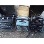 3 typewriters to include Remington, Olympia- made on Germany and Olivetti lettera 22 all on cases