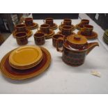 Hornsea 'heirloom' 1976 set in saffron colour comprising of a teapot, serving plate, 11 cake plates,