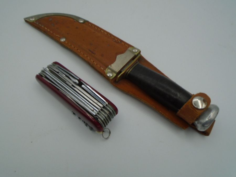 Original swiss style army knife with all components and a Bowie knife with leather case