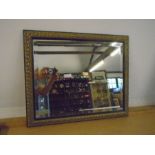 gilt and black framed bevelled mirror 58x48cm