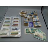 cigarette card collection, some loose, some in folder