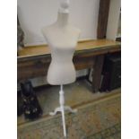 Mannequin on stand. small stain on rear