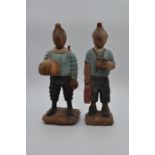 2 wooden Tintin figurines one in spacesuit, one carrying binoculars 30cm tall